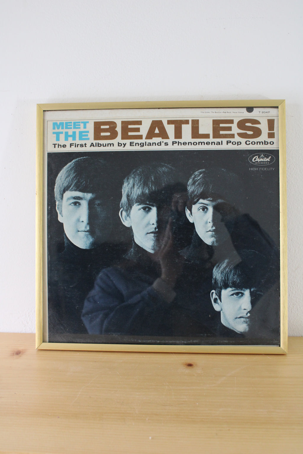 Meet The Beatles: The First Album By England's Phenomenal Pop Combo Framed Vinyl Record