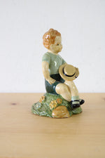 1957 Boy Sitting With Hat Ceramic Figurine