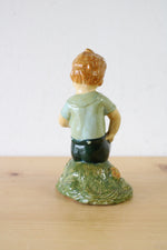 1957 Boy Sitting With Hat Ceramic Figurine