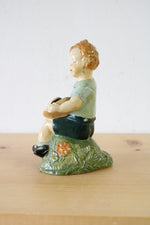 1957 Boy Sitting With Hat Ceramic Figurine