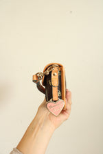 Dooney & Bourke Brown Signature Logo Flap Wristlet