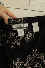 Nine & Company Black and Off-white Rose Printed Stretch Skirt | 1XL