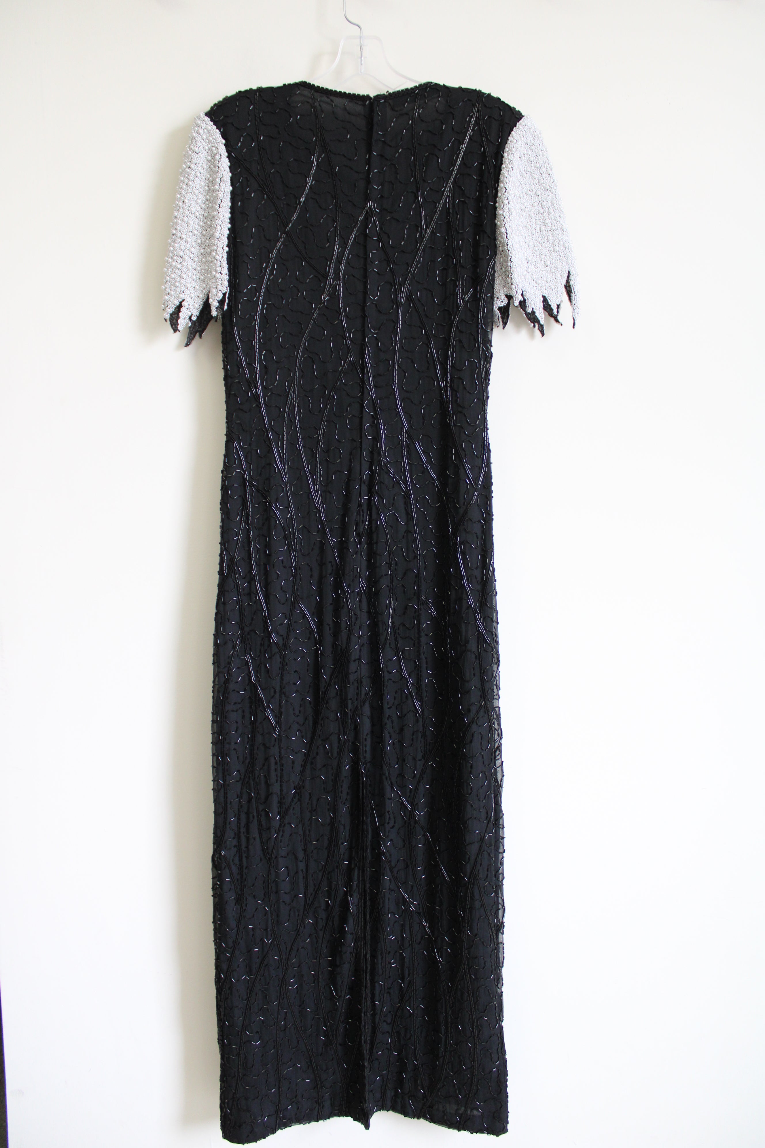 vintage scala beaded dress Vintage SCALA Navy Blue Beaded Floor Length Gown with Plunging Necklin The Thrifty Hippy