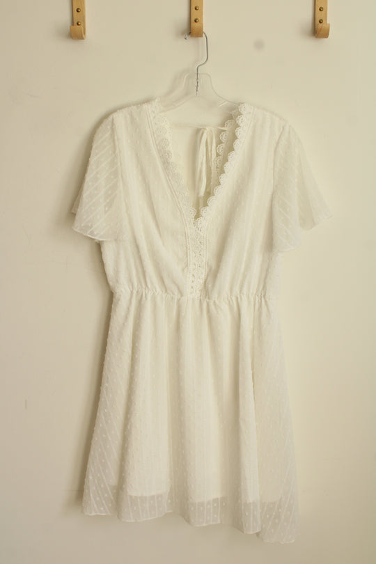 White Lace Dress with Embroidered Neckline and Details