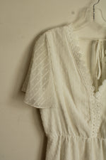 White Lace Dress with Embroidered Neckline and Details