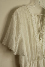 White Lace Dress with Embroidered Neckline and Details