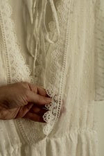 White Lace Dress with Embroidered Neckline and Details